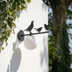 Lindby Außenwandleuchte Lintu, Metall, schwarz, IP44, Vogel