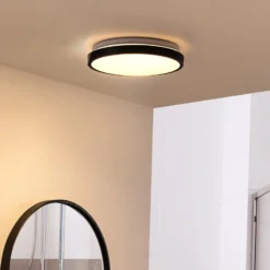 Lindby LED-Deckenlampe Medon Ø 29 cm schwarz Kunststoff IP44